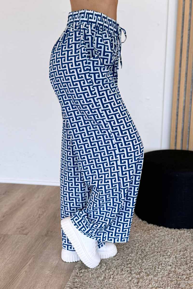 Elastische Hose mit weitem Bein und grafischem Muster Blau